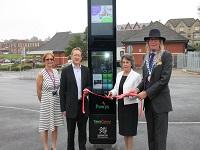 Image of people cutting a ribbon at an opening ceremony for a transport interchange