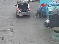 Image of man fly-tipping rubbish at recycling banks in Llansantffraid